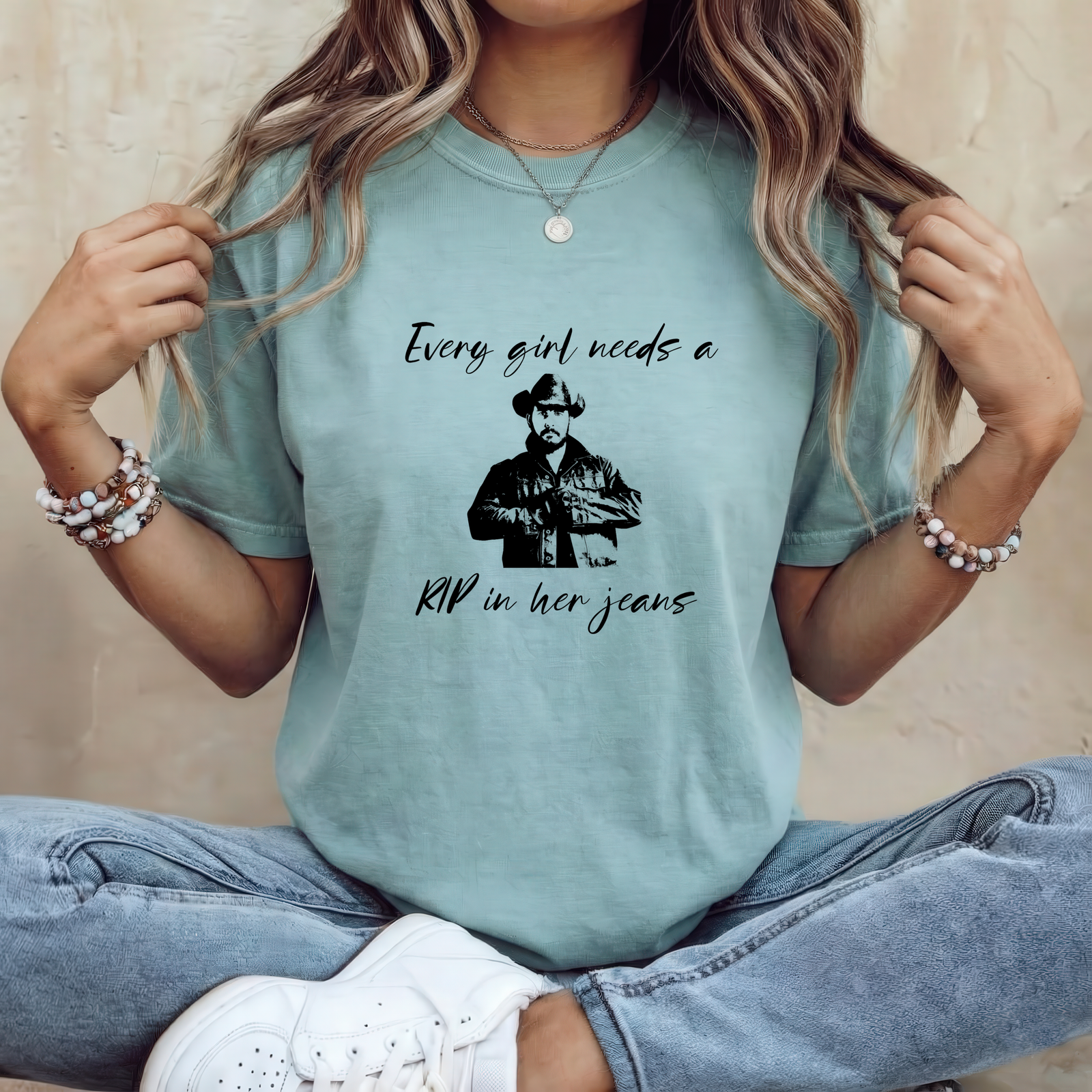 Mockup Woman_30 "Every Girl Needs a Rip in Her Jeans" Funny Yellowstone T-Shirt – Rip Wheeler Graphic Tee – Western Fan Apparel – Cowboy Humor Shirt – Unisex Tee Shirt Premium Fitted 100% Cotton Tee - Image 1