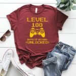 Level 100 Days of School Unlocked T-Shirt – Funny Gamer Student Celebration – Unisex Tee Shirt Premium Fitted 100% Cotton Tee