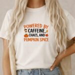 Powered By Caffeine Chaos And Pumpkin Spice T-Shirt, Funny Fall Season Tee, Autumn Coffee Lover Shirt, Thanksgiving Graphic Apparel Apparel Clothing Premium Fitted 100% Cotton
